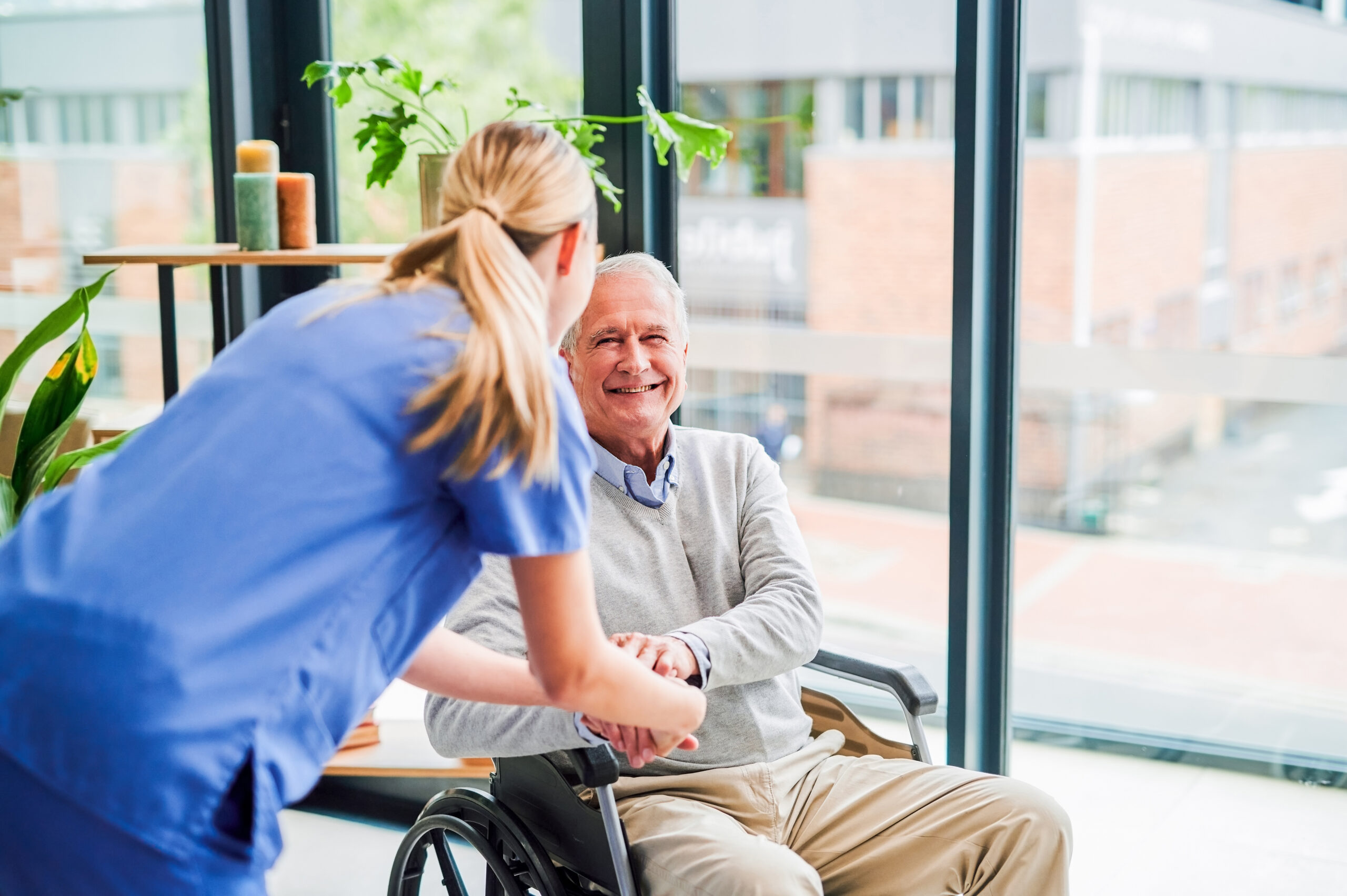 Shot Of A Young Female Doctor Comforting A Senior Patient At A Clinic